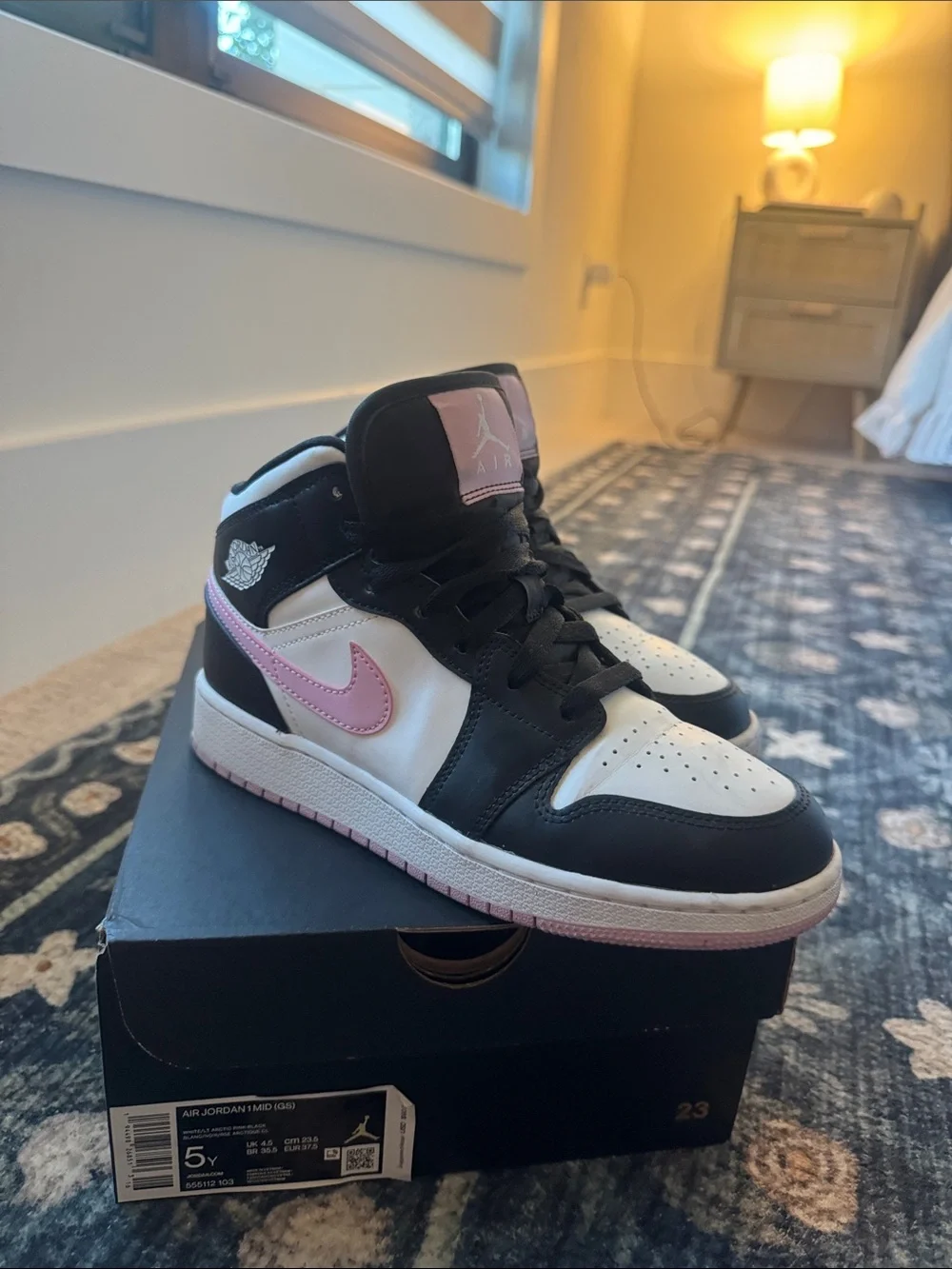 Nike Air Jordan 1 Mid High-Top Sneakers in Black, White & Pink